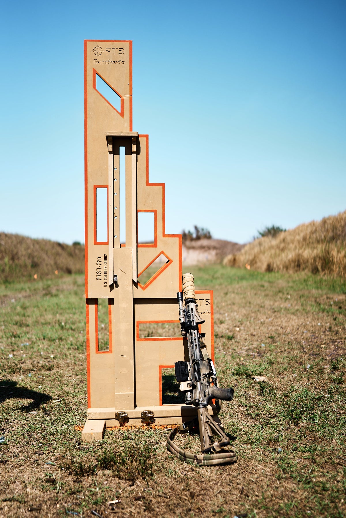PTS Barricade Pro portable shooting barricade set up at an outdoor range with a rifle