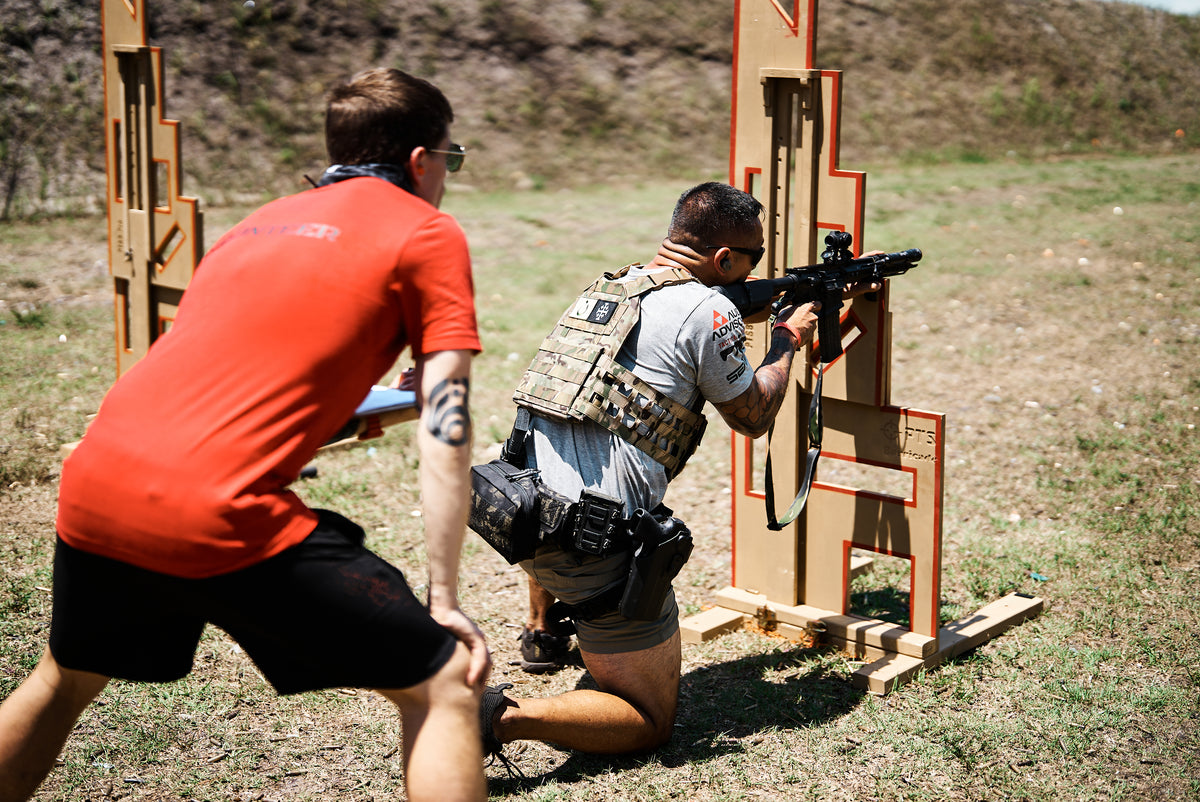 Shooter and coach using a PTS Barricade at an outdoor range